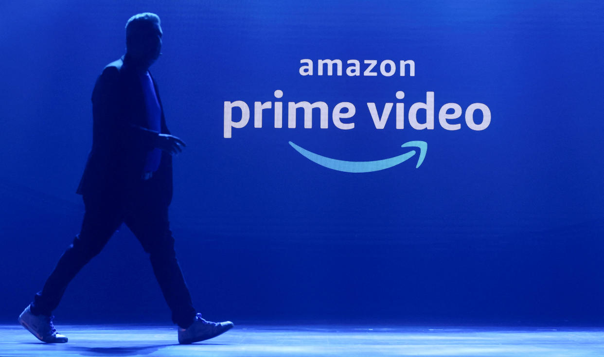 FILE PHOTO: A man walks past a logo of Amazon Prime Video during a launch event in Mumbai, India, April 28, 2022. REUTERS/Francis Mascarenhas/File Photo