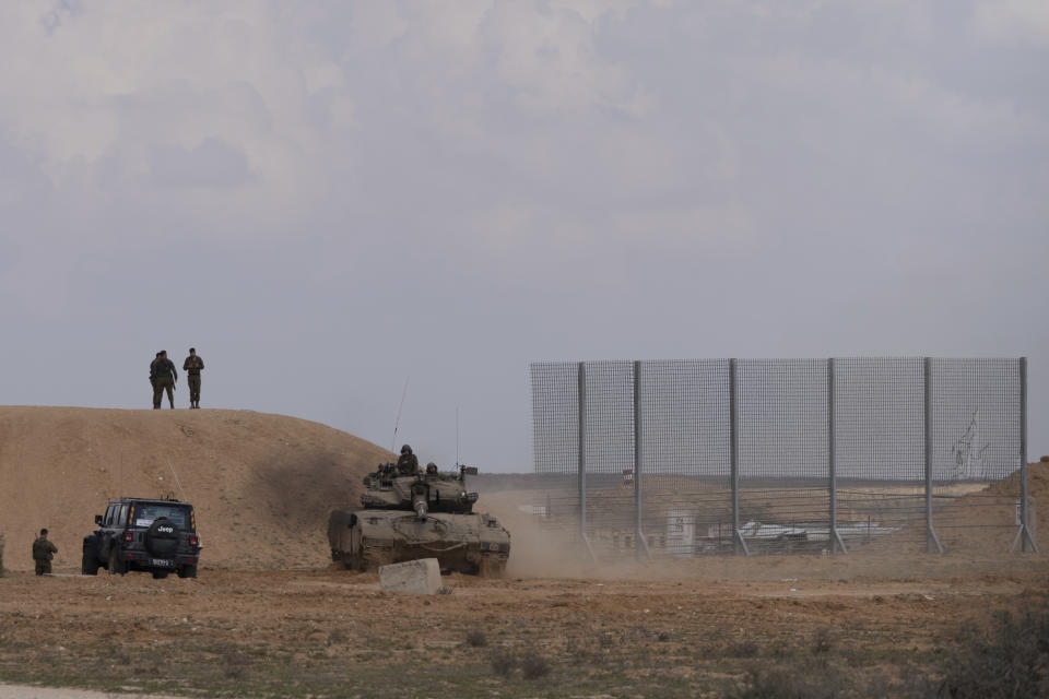 Israeli soldiers take part in a training drill on an area in southern Israel, Wednesday, Feb. 14, 2024. (AP Photo/Ohad Zwigenberg)