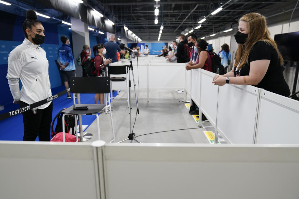 Jessica O'Beirne, right, interviews Mandy Mohamed, an artistic gymnast from Egypt, after the women's artistic gymnastic qualifications at the 2020 Summer Olympics, Monday, July 26, 2021, in Tokyo, Japan. Many in the world of gymnastics have a love-hate relationship with their noisy, often noxious, corner of the internet that they call the gymternet. O'Beirne started her podcast in 2012 because she didn’t like how mainstream media covered the sport. Women athletes were often infantilized and presented as objects without agency. (AP Photo/Ashley Landis)