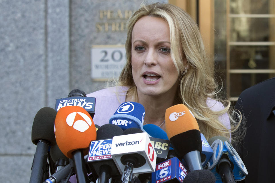 FILE - In this April 16, 2018 file photo, adult film actress Stormy Daniels speaks outside federal court in New York. Daniels, whose real name is Stephanie Clifford, said she had a one-night-stand with Donald Trump in 2006. According to President Trump's former personal attorney Michael Cohen, days before the 2016 election, Trump instructed him to pay Daniels $130,000 to keep her from talking about it. (AP Photo/Mary Altaffer, File)