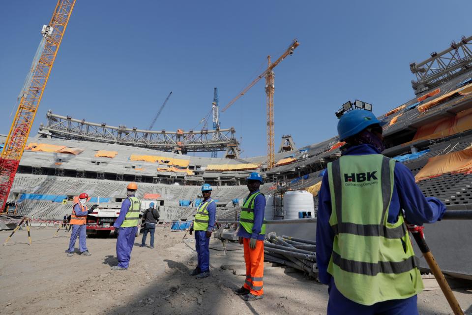 People work at Lusail Stadium, one of the 2022 World Cup stadiums, in Lusail, Qatar, Friday, Dec. 20, 2019.