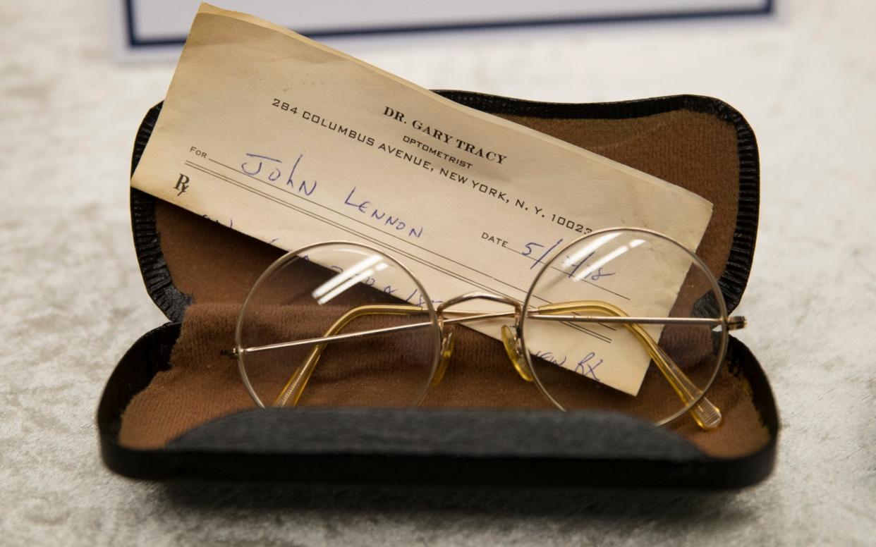 Glasses beloging to John Lennon with a prescription by optician Gary Tracy on show at police headquarters in Berlin - AP