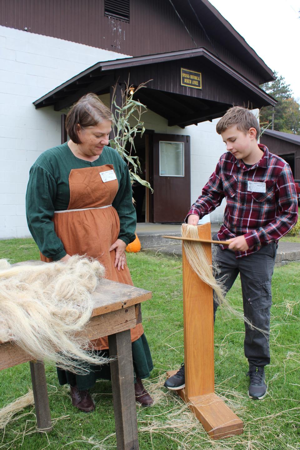 Bernard Orendorf gets the oven hot for the unbaked loaves of bread during last year's Springs Folk Festival.