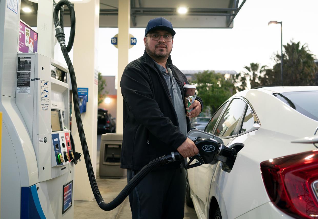 A man pumps gasoline into his car at a gas station in Millbrae, California, May 16, 2022. (Photo by Li Jianguo/Xinhua via Getty Images)