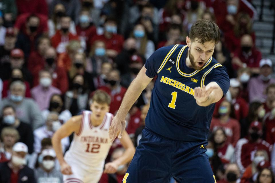 Michigan center Hunter Dickinson reacts to a made basket in the first half on Sunday, Jan. 23, 2022, in Bloomington, Indiana.