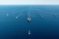 FILE - In this photo provided by the South Korea Defense Ministry, the USS Ronald Reagan aircraft carrier, center, participates in a joint anti-submarine drill among South Korea, the United States and Japan in waters off South Korea's eastern coast in South Korea on Sept. 30, 2022. (South Korea Defense Ministry via AP, File)