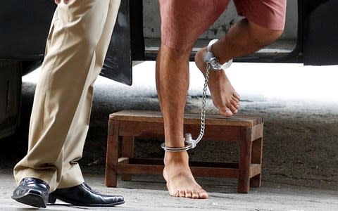 Mr Araibi's feet were shackled as he arrived in a Thai criminal court last week  - Credit: REUTERS/Jorge Silva