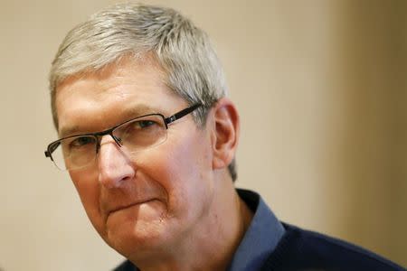 Apple Chief Executive Officer Tim Cook speaks during an event for students to learn to write computer code at the Apple store in the Manhattan borough of New York in this December 9, 2015 file photo. REUTERS/Carlo Allegri/Files