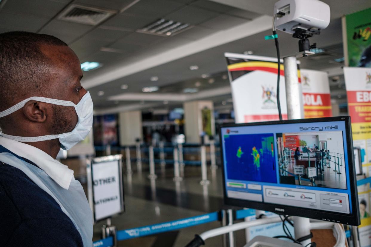 Airport personel prepare for passengers arriving on international flights at the port health desk where they are screened for signs of the novel coronavirus at Entebbe Airport on March 3, 2020. - The deadly virus has marched well beyond China's borders, spreading across Asia and Europe and into Latin America, Africa and the United States. More than 90,000 people have been infected and 3,100 killed since the virus first emerged in China's Hubei province late last year. (Photo by SUMY SADURNI / AFP) (Photo by SUMY SADURNI/AFP via Getty Images)