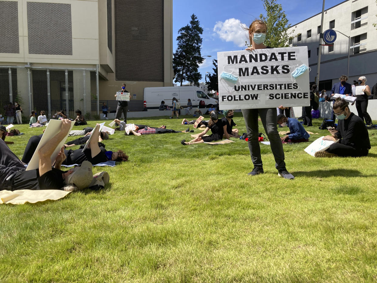 Protesters call for administrators to mandate masks and vaccination at a 