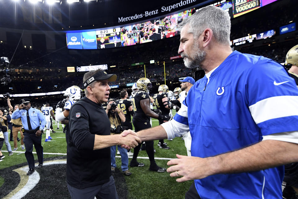 New Orleans Saints head coach Sean Payton, left, greets Indianapolis Colts head coach Frank Reich after an NFL football game in New Orleans, Monday, Dec. 16, 2019. The Saints won 34-7. (AP Photo/Bill Feig)