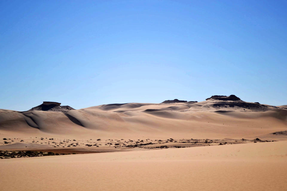 This September 2012 photo shows The Great Sand Sea, 28,000 square miles of rolling dunes along the northern edge of the Sahara, one of the main attractions of a visit to the Egyptian oasis of Siwa, a Berber town of some 27,000 people roughly 450 miles (about 725 kilometers) southwest of Cairo. The palm tree-lined area is known for its quiet charm, ancient ruins, abundant natural springs, a vast salt lake and rolling sand dunes in the surrounding desert. (AP Photo/Kim Gamel)