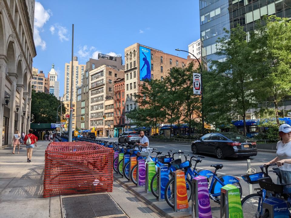 <p>A picture from the Pixel 6a's ultrawide camera, featuring colorful Citibike posts and several blue bicycles with several NYC buildings in the background.</p>
