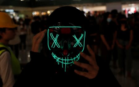 An anti-government protester wears a mask during a demonstration in Hong Kong