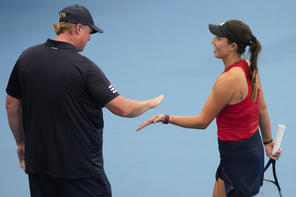 FILE - United States' Jessica Pegula is congratulated by team captain David Witt following her win over Germany's Laura Siegemund in their Group C match at the United Cup tennis event in Sydney, Australia, Tuesday, Jan. 3, 2023. Only six of the 128 women entered in singles at Wimbledon work with a female coach. (AP Photo/Mark Baker, File)