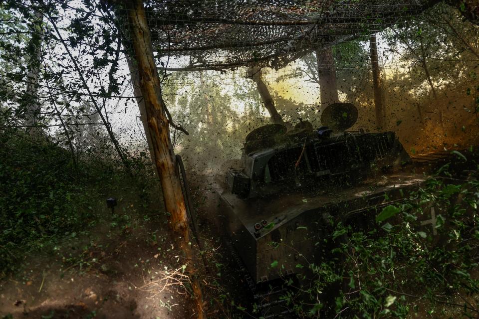 Ukrainian servicemen of the 42nd Separate Mechanized Brigade fire a 2S1 Gvozdika self-propelled howitzer towards Russian troops in the Kharkiv region (REUTERS)