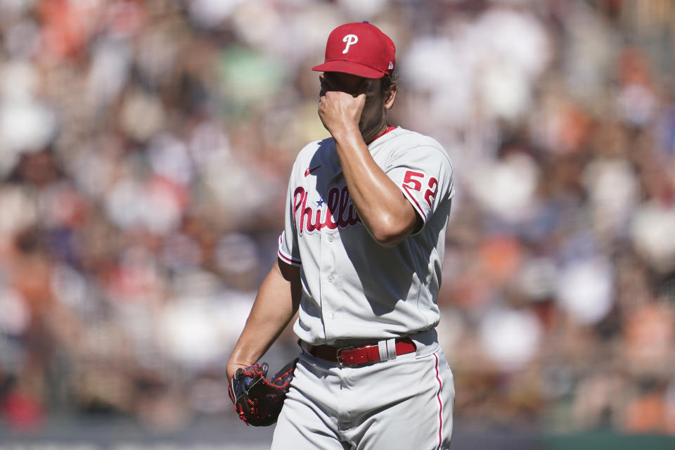 Philadelphia Phillies pitcher Brad Hand reacts after walking San Francisco Giants' Joc Pederson with the bases loaded that scored J.D. Davis during the sixth inning of a baseball game in San Francisco, Saturday, Sept. 3, 2022. (AP Photo/Jeff Chiu)