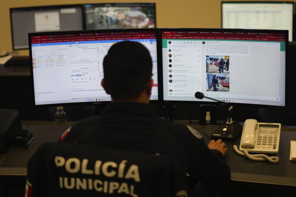 A municipal police officer monitors social media sites at a police control and monitoring center, in Celaya, Mexico, Wednesday, Feb. 28, 2024. Celaya, unusual among municipal police, does its own intelligence and investigation work. (AP Photo/Fernando Llano)