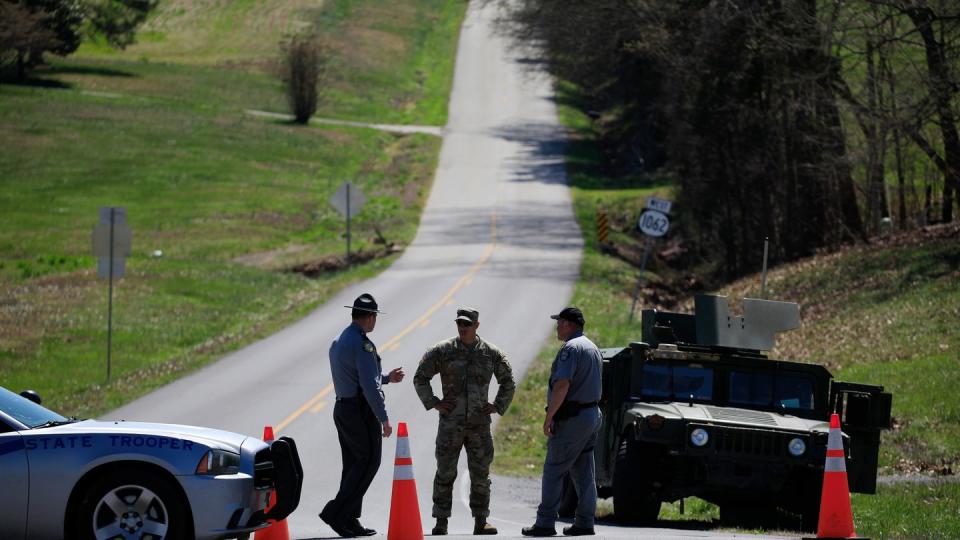 A U.S. Army Humvee sits parked at a checkpoint near the site where two UH-60 Black Hawk helicopters crashed on March 30, 2023, in Cadiz, Ky. Nine soldiers were killed in the incident that occurred during a night training mission. (Luke Sharrett/Getty Images)