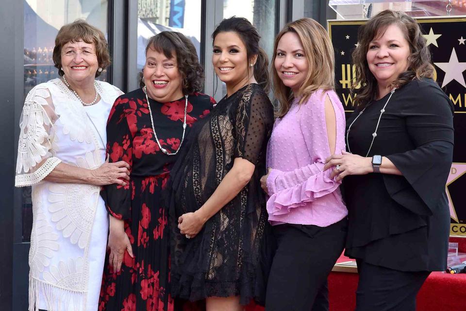 <p>Axelle/Bauer-Griffin/FilmMagic</p> Eva Longoria with her mom Ella Eva Mireles, sisters Esmeralda Josephina Longoria, Elizabeth Judina Longoria and Emily Jeannette Longoria attend the ceremony honoring Eva Longoria with a star on the Hollywood Walk of Fame in 2018