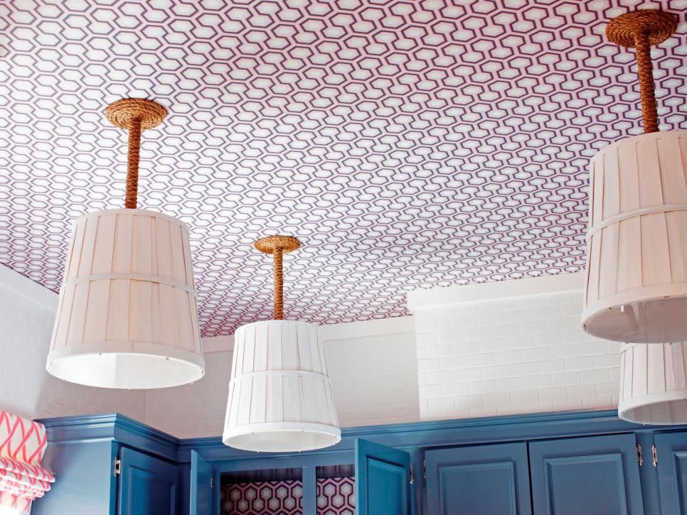 A graphic wallpapered kitchen ceiling.