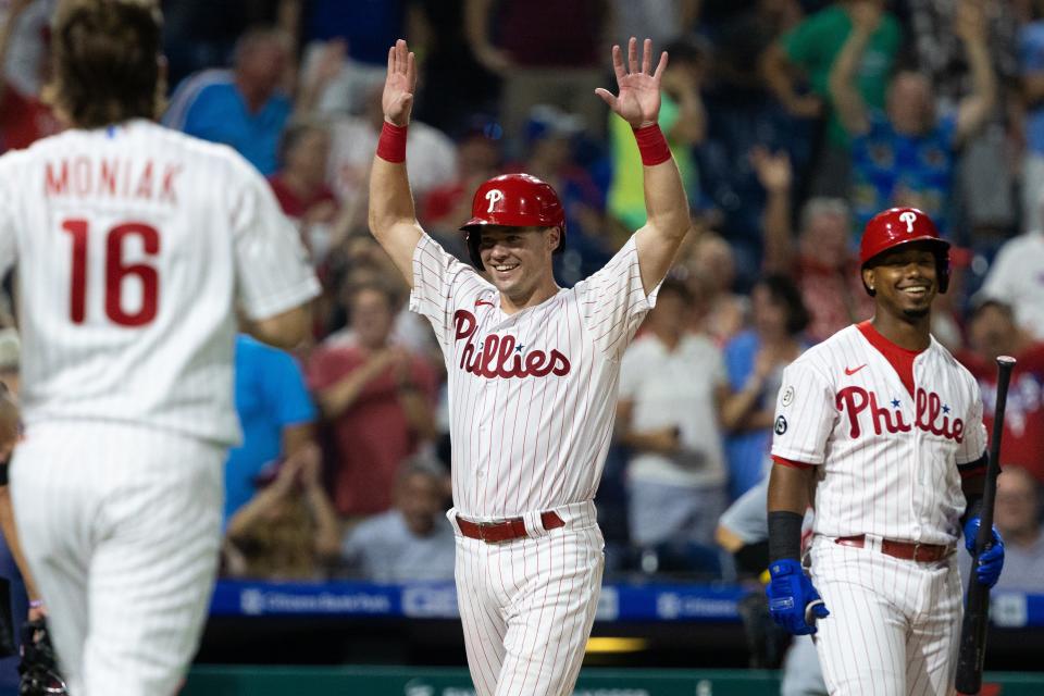 Sep 15, 2021; Philadelphia, Pennsylvania, USA; Philadelphia Phillies catcher Andrew Knapp (5) celebrates in front of shortstop Jean Segura (2) after scoring the game winning run on a pass ball during the ninth inning against the Chicago Cubs at Citizens Bank Park. Mandatory Credit: Bill Streicher-USA TODAY Sports