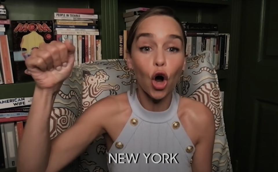 Emilia pumps her fist while imitating a New Yorker