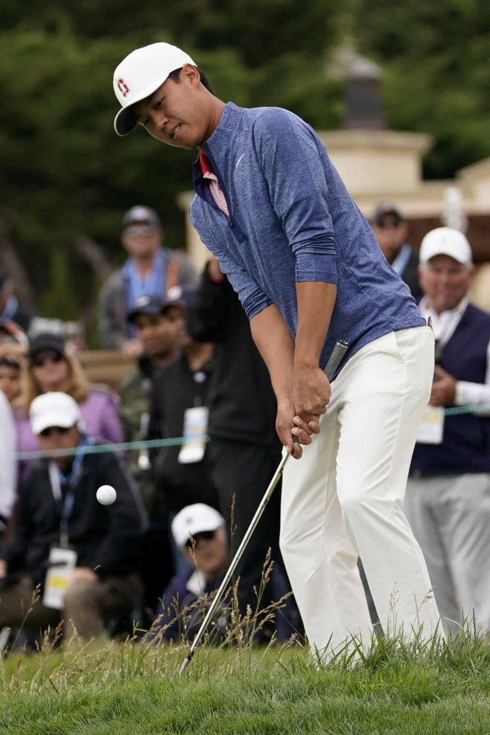 Amateur player, Brandon Wu, hits a chip shot on the second hole during the final round of the U.S. Open Championship golf tournament Sunday, June 16, 2019, in Pebble Beach, Calif. (AP Photo/Carolyn Kaster)