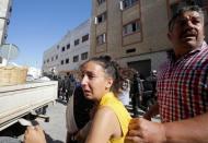 Civilians take cover from tear gaz during a demonstration against official abuses and corruption in the town of Al-Hoceima, Morocco July 20, 2017. REUTERS/Youssef Boudlal