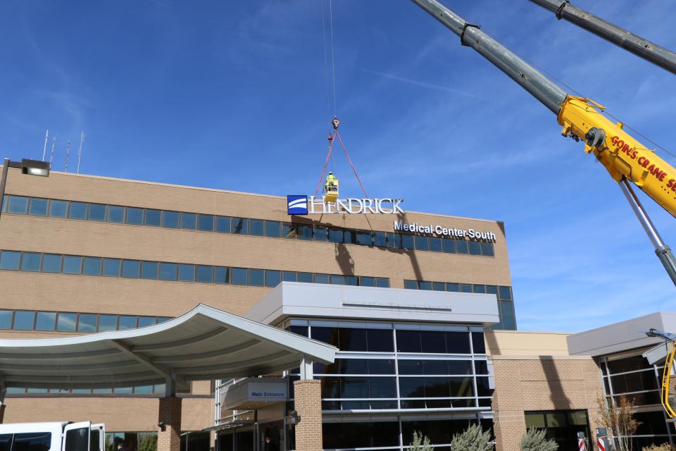 A crew puts up a new sign for Hendrick Medical Center South, the former Abilene Regional Medical Center. The two hospital systems merged in 2020.