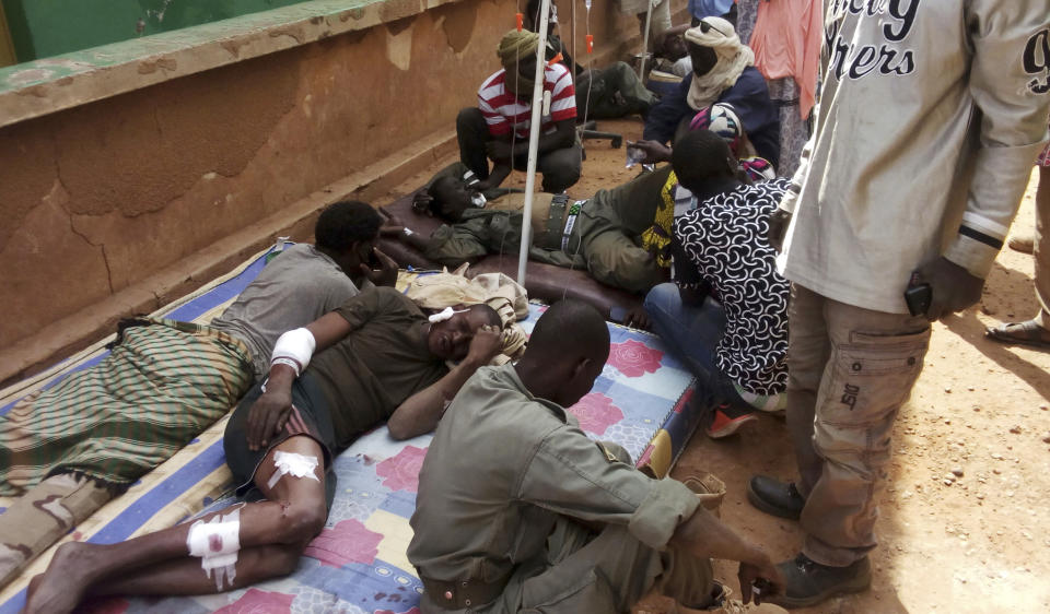 Wounded Malian troops receive medical treatment after being injured by an explosion at the Joint Operational Mechanism base in Gao, Mali, Wednesday, Jan. 18, 2017. A suicide bomber in an explosives-laden vehicle attacked a camp in northern Mali on Wednesday, killing more than 50 people and wounding more than 100 soldiers and former fighters now trying to stabilize the region. (AP Photo/Yacouba Cisse)