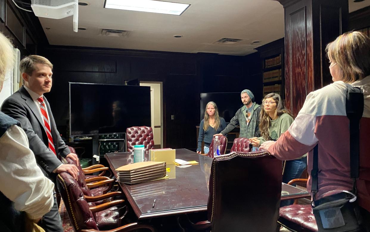 Etowah County Assistant District Attorney Brynn Crain talks to family members and friends of A.J. Huff Friday, after Lonterry Orlando Harrison Jr. was sentenced to life in prison without parole in Huff's 2018 slaying.