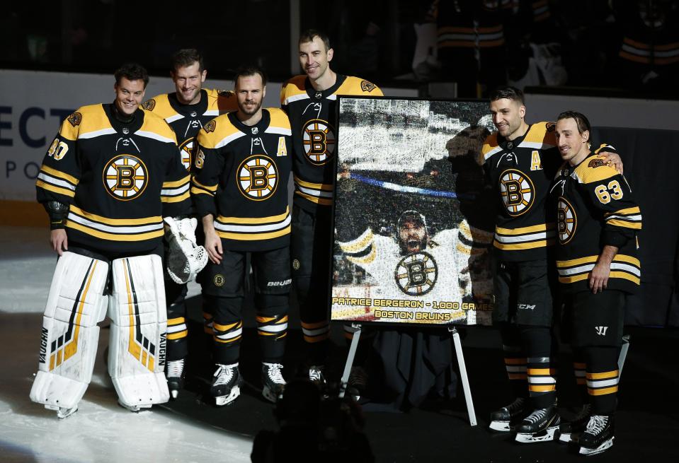 <p>
              Boston Bruins' Patrice Bergeron, second from right, stands with teammates from left, Tuukka Rask, David Backes, David Krejci, Zdeno Chara and Brad Marchand during a ceremony honoring Bergeron for playing in his 1,000 career game before an NHL hockey game between the Boston Bruins and the Los Angeles Kings, Saturday, Feb. 9, 2019, in Boston. (AP Photo/Winslow Townson)
            </p>