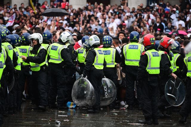 Police watch fans in Trafalgar Square