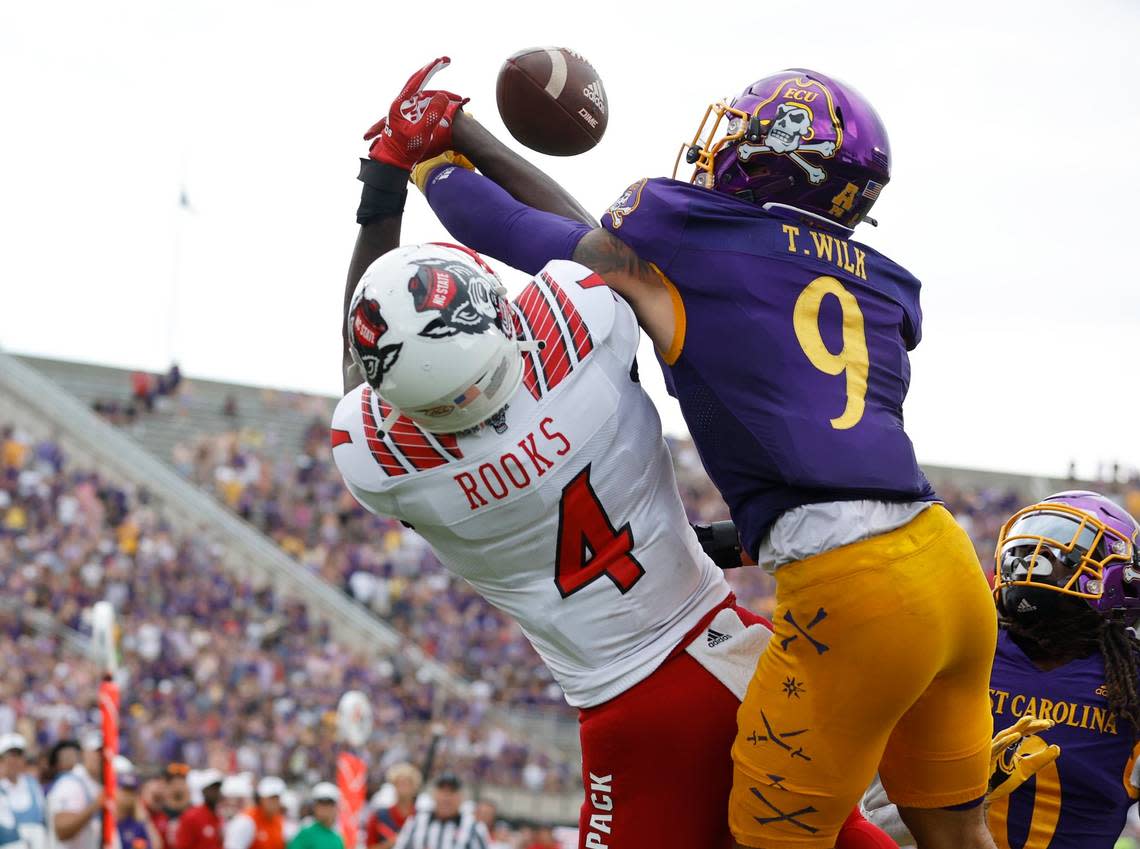 N.C. State wide receiver Porter Rooks (4) cant haul in a potential touchdown reception as East Carolina safety Teagan Wilk (9) defends during the second half of N.C. States 21-20 victory over ECU at Dowdy-Ficklen Stadium in Greenville, N.C., Saturday, Sept. 3, 2022.