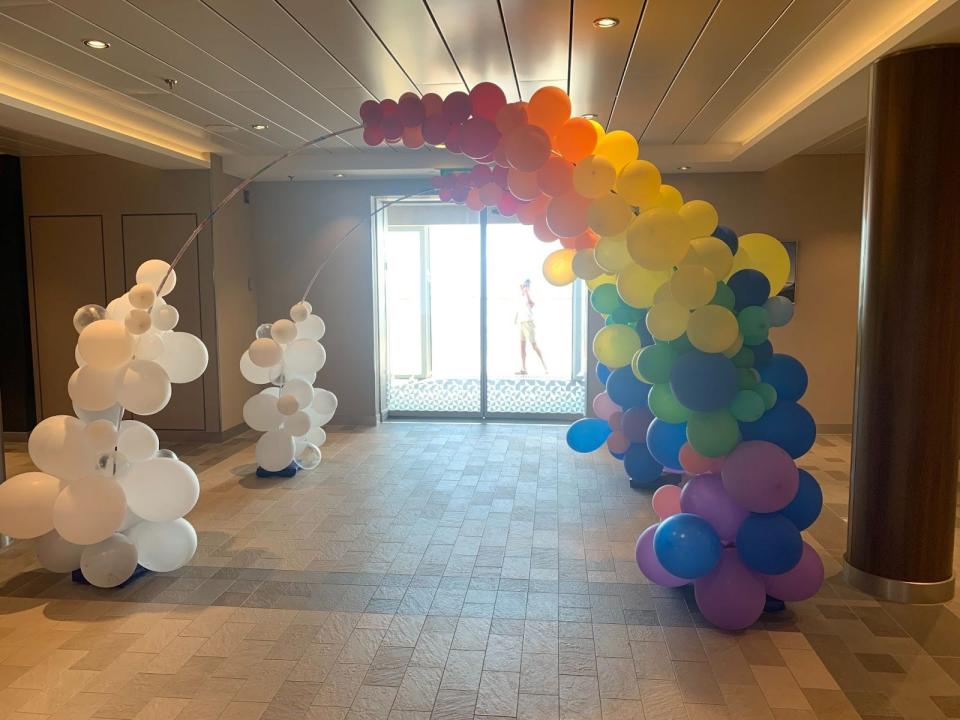 a rainbow balloon arch