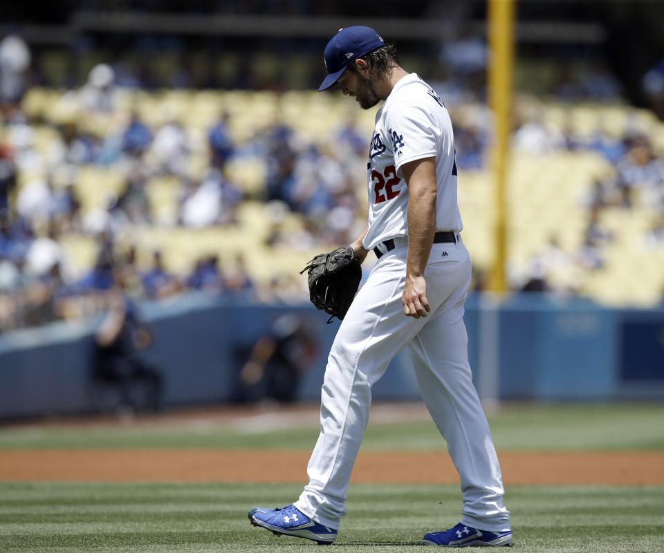 Los Angeles Dodgers starting pitcher Clayton Kershaw walks off the mound during the first inning of a baseball game against the Atlanta Braves in Los Angeles, Sunday, July 23, 2017.