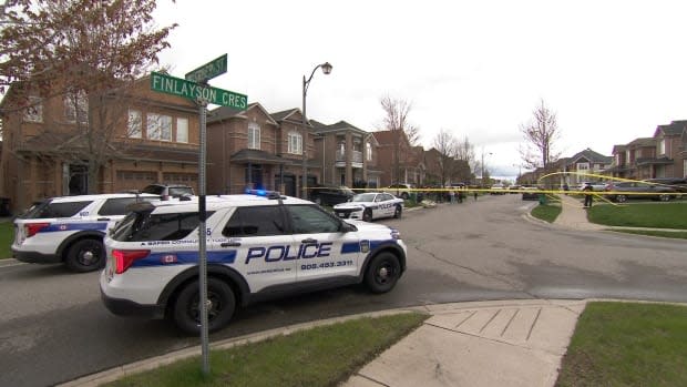 Peel police cruisers are parked close to the spot where the child was found.