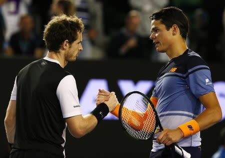 Britain's Andy Murray (L) and Canada's Milos Raonic shake hands after Murray won their semi-final match at the Australian Open tennis tournament at Melbourne Park, Australia, January 29, 2016. REUTERS/Thomas Peter