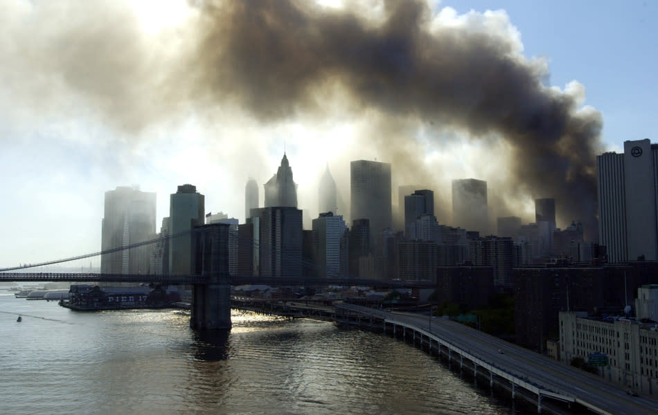 Smoke billows toward the harbor after the terrorist attack on the World Trade Center. (Photo by Jason Nevader/WireImage)