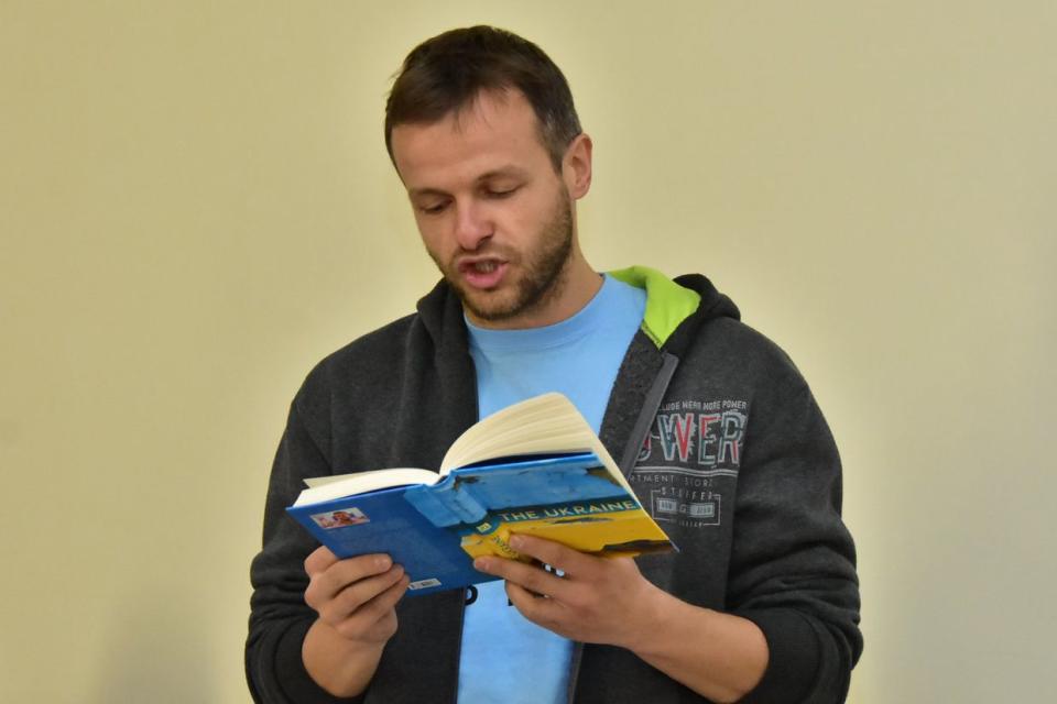 Artem Chapeye reads the excerpt from his book "The Ukraine" during the presentation. (facebook.com)