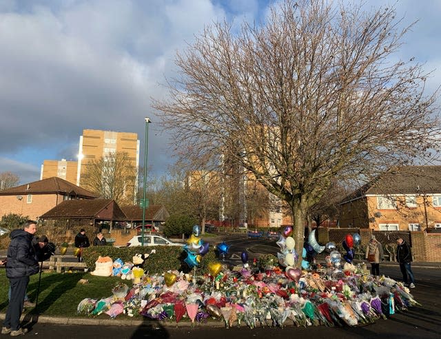 Flowers and tributes lay near to the scene in Babbs Mill Park in Kingshurst, Solihull 