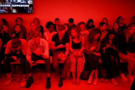 Members of the public attend the Alexa Chung public catwalk show during London Fashion Week in London