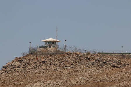 A U.N. Disengagement Observer Force (UNDOF) Base is seen at the Quneitra border crossing between the Israeli-controlled Golan Heights and Syria, seen from the Syrian side of the border in Quneitra, Syria July 10, 2017. REUTERS/Alaa al-Faqir