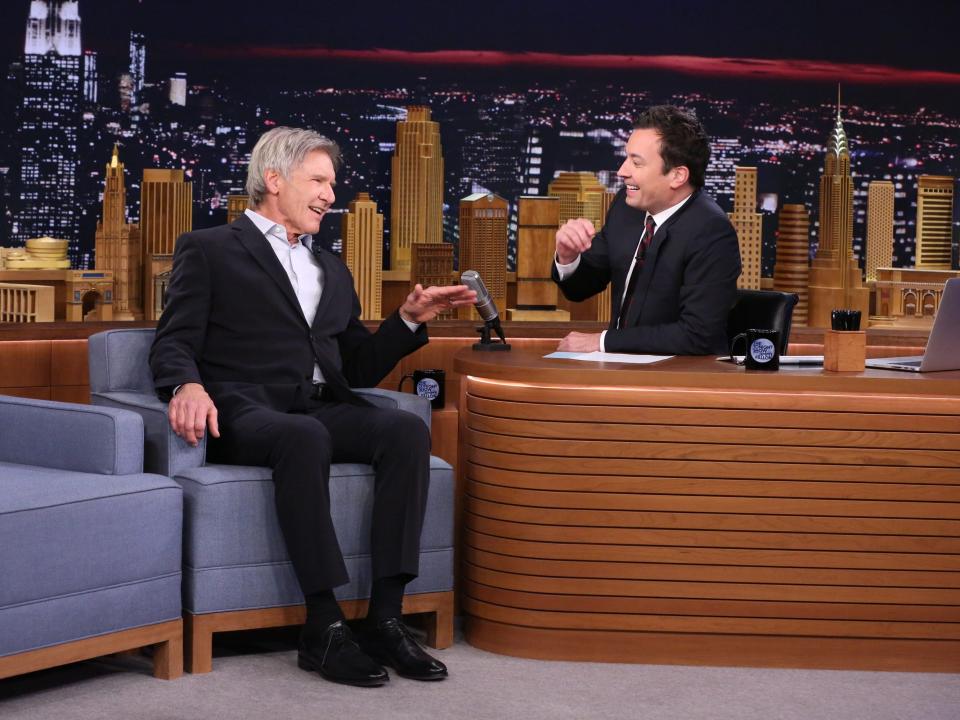 Harrison Ford smiles while talking to Jimmy Fallon during a 2015 episode of "The Tonight Show."