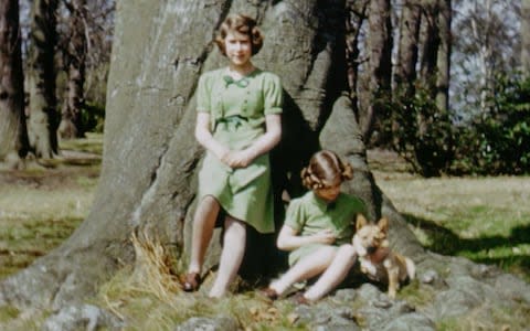 The Queen and Princess Margaret leaning against a large tree - Credit: ITV