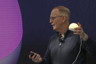 Dave Limp, senior vice president for Amazon devices & services, holds an Echo Glow device, designed to serve as a nightlight in a children's bedroom, as he speaks Wednesday, Sept. 25, 2019, at an event in Seattle to unveil new products that work with the company's Alexa smart devices line. (AP Photo/Ted S. Warren)