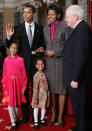 U.S. Senator Barack Obama (D-IL) (2nd L) poses for with his wife Michelle (2nd R), Vice President Dick Cheney (R), daughters (C) Malia and Sasha during the reenactment of a swearing -in ceremony on Capitol Hill January 4, 2005 in Washington, DC. The 109th Congress was sworn in January 4. (Photo by Alex Wong/Getty Images)