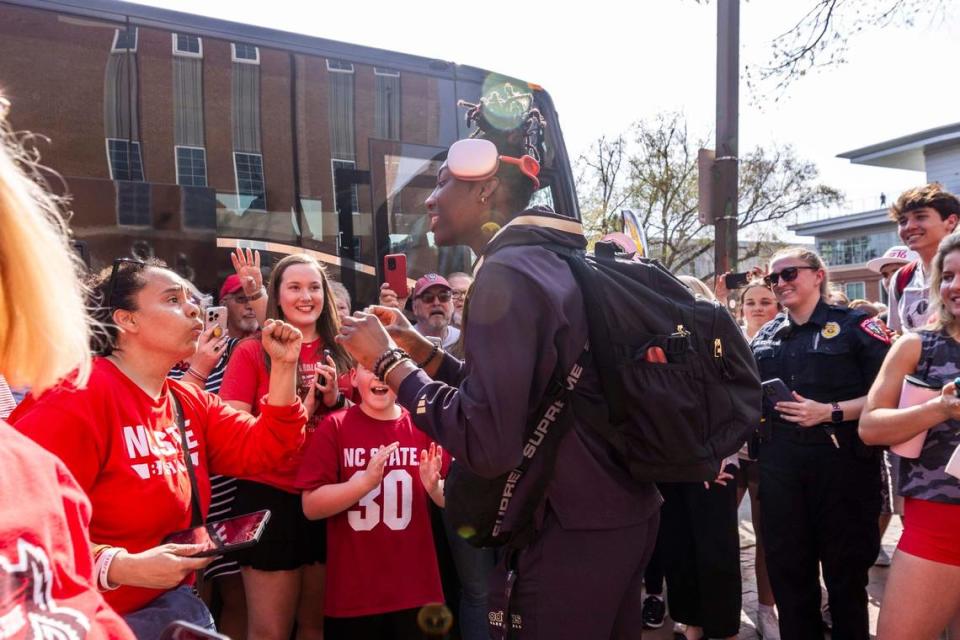 NC State’s Saniya Rivers is greeted by fans on Tuesday, April 2, 2024 while boarding a bus outside Reynolds Coliseum bound for the Final Four game on Friday. Travis Long/tlong@newsobserver.com