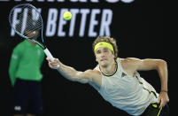 Germany's Alexander Zverev makes a forehand return to United States' Maxime Cressy during their second round match at the Australian Open tennis championship in Melbourne, Australia, Wednesday, Feb. 10, 2021.(AP Photo/Rick Rycroft)